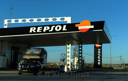 A driver exits a Repsol YPF SA gas station in Tembleque, Spain.  Bloomberg
A driver exits a Repsol YPF SA gas station in Tembleque, Spain.  Bloomberg
