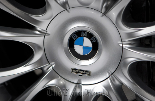 The BMW logo is displayed on the wheel of a company car. Bloomberg