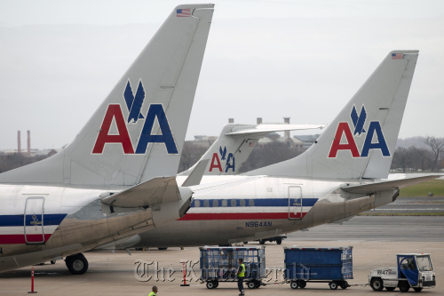 American Airlines Inc. planes sit on the tarmac at Ronald Reagan National airport in Washington, D.C.  Bloomberg