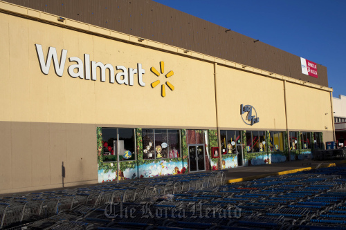 Shopping carts stand outside of a Wal-Mart store in Guadalajara, Mexico.  Bloomberg