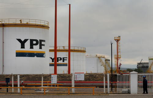 An employee stands at the YPF SA refinery in Lujan de Cuyo, Argentina, on Tuesday, April 17, 2012. Argentina's seizure of YPF SA threatens to take the country further away from its goal of energy self-sufficiency as investors weigh the increased risk of expropriation in South America's second-biggest economy. Photographer Walter Moreno/Bloomberg
An employee stands at the YPF SA refinery in Lujan de Cuyo, Argentina.     Bloomberg