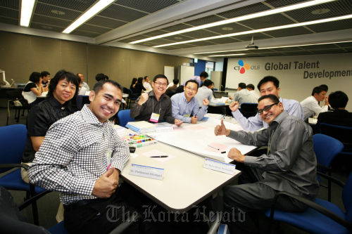 CJ GLS Corp. employees pose while taking part in the logistics company’s global talent development program.  CJ GLS