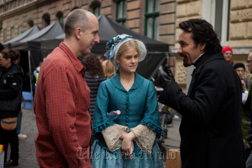 Director James McTeigue (left) discusses a scene with stars Alice Eve and John Cusack on the set of Relativity Media’s stylish gothic thriller “The Raven.”  MCT