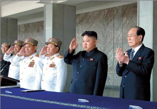 North Korean leader Kim Jong-un (second from right) salutes with Choe Ryong-hae (third
from right), vice chairman of the Central Military Commission and Korean People’s Army General Staff Chief Ri Yong-ho (fourth from right) during a mass military parade marking the centenary of the birth of his grandfather, national founder Kim Il-sung in Pyongyang last Sunday.    (AP-Yonhap News)