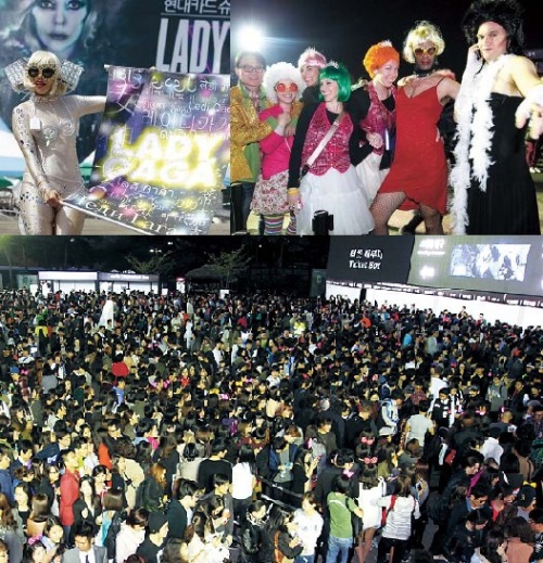 Lady Gaga fans, many of them dressed up in Lady Gaga-like costumes, are seen waiting outside the concert venue on Friday night. (Yonhap News)