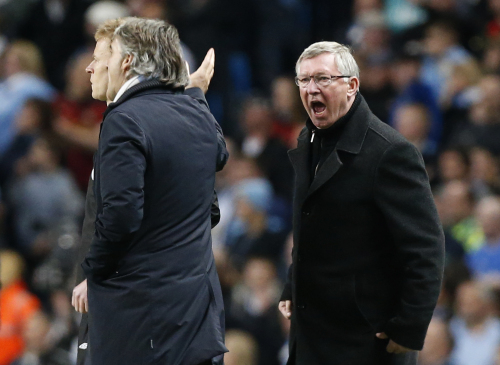 <YONHAP PHOTO-0358> Manchester United's manager Sir Alex Ferguson, right, shouts towards Manchester City's manager Roberto Mancini, second left, as he gestures during the English Premier League soccer match between Manchester City and Manchester United at the Etihad Stadium in Manchester, Monday, April 30, 2012. (AP Photo/Matt Dunham) /2012-05-01 06:26:15/ <저작권자 ⓒ 1980-2012 ㈜연합뉴스. 무단 전재 재배포 금지.>
Manchester United manager Alex Ferguson shouts at Manchester City manager Roberto Mancini.  AP-Yonhap News