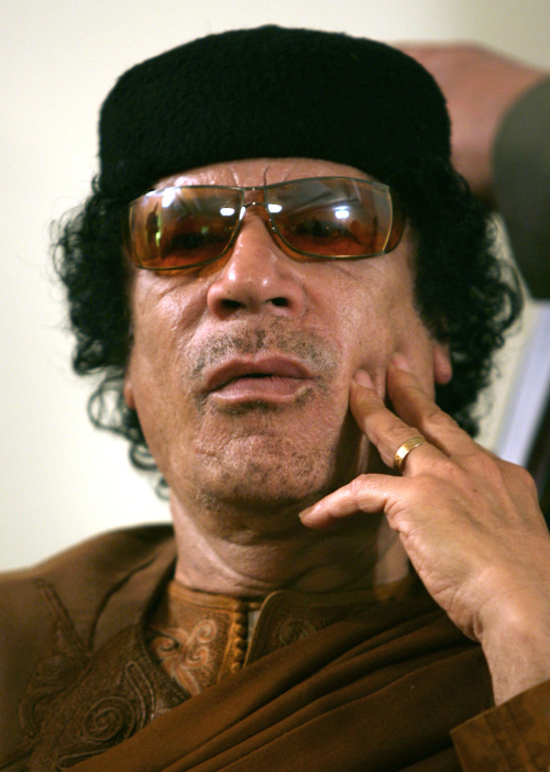 <YONHAP PHOTO-1670> FILE - In this Friday, March 2, 2007 file photo Libya's Moammar Gadhafi attends a debate on the sidelines of celebrations marking the 30-year anniversary of the declaration of the "jamahiriya," or "rule of the masses", in Sabha, Libya. Former Liberian President Charles Taylor is part of a long parade of leaders guilty or accused of similar, and in some cases far more appalling, crimes in modern history. Here is what happened to some: Moammar Gadhafi: Libya's leader became the first ruler killed in the Arab Spring uprisings that swept the region in 2011. He ruled for nearly 42 years with an eccentric brutality, turning Libya into an isolated pariah, then an oil power courted by the West, then back again. The rebels who toppled him were backed by a NATO bombing campaign. (AP Photo/Nasser Nasser, file)/2012-04-26 22:49:15/ <저작권자 ⓒ 1980-2012 ㈜연합뉴스. 무단 전재 재배포 금지.>
Moammar Gadhafi. AP-Yonhap News