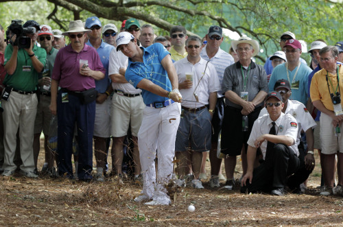 <YONHAP PHOTO-0028> Rory McIlroy, of Northern Ireland, hits out of the rough off the first fairway during the first round of the Masters golf tournament Thursday, April 5, 2012, in Augusta, Ga. (AP Photo/Darron Cummings)/2012-04-06 03:37:29/ <저작권자 ⓒ 1980-2012 ㈜연합뉴스. 무단 전재 재배포 금지.>
Rory McIlroy is growing into his role as the biggest of the game’s rising stars.  AP-Yonhap News