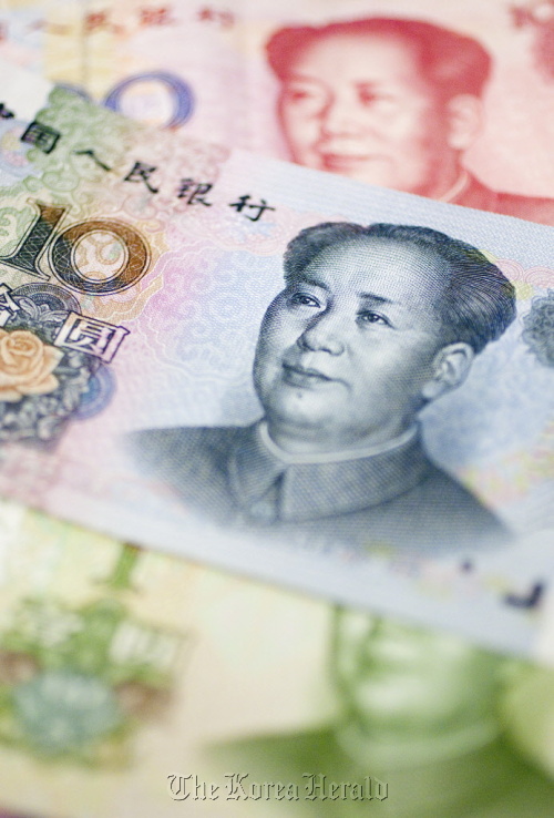 Yuan bank notes are arranged in Washington, D.C.  Bloomberg