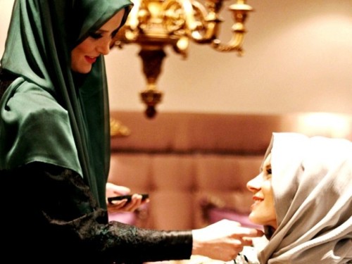 The models in the magazine reflect a conservative Islamic style with head scarves and covered arms and necks.        AFP