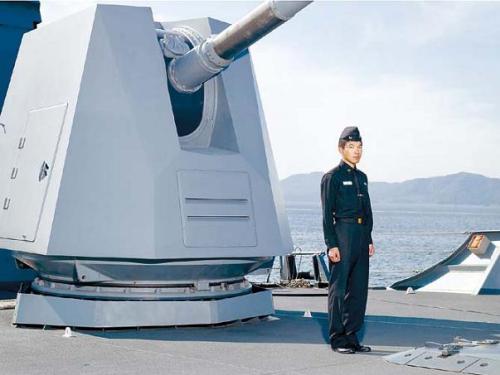 “A Petty Officer Standing in Front of 127mm Naval Artillery Gun” (Artsonje Center)