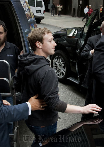 Mark Zuckerberg, founder and chief executive officer of Facebook Inc., leaves the Sheraton hotel in New York. Bloomberg