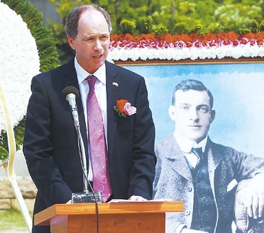 U.K. Ambassador Scott Wightman gives a speech in front of an
image of Ernest Bethell at a memorial in Seoul on May 8. (Yonhap)