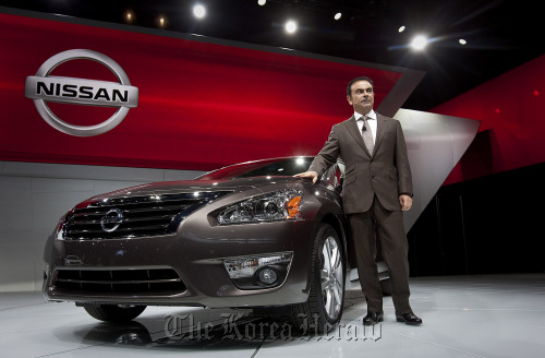 Carlos Ghosn, chairman and CEO of Nissan Motor Co., introduces the Altima during a news conference at the New York International Auto Show.  Bloomberg