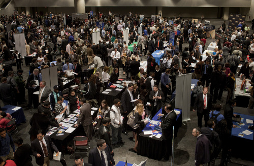 Job seekers wait to speak to recruiters at the "Putting America Back To Work!" job fair in New York, U.S., on Tuesday, May 15, 2012. The U.S. Department of Labor is scheduled to release initial and continuing jobless claims data on May 17. Photographer: Victor J. Blue/Bloomberg
Job seekers wait to speak to recruiters at a job fair in New York on Wednesday.  Bloomberg