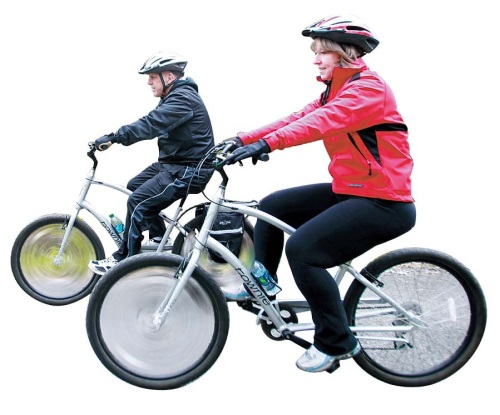 Don, left, and Darla Daley of Royal Oak joined Weight Watchers, bought bicycles and have each lost a great amount of weight. Here, they ride along a bike path in Auburn Hills, Michigan, April 11 (MCT)