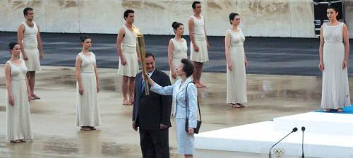 Princess Anne holds the Olympic torch during the handover ceremony in Athens on Thursday.   (Xinhua-Yonhap News)