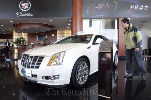 A General Motors Co. Cadillac CTS Coupe is displayed at a dealership in Beijing.  Bloomberg