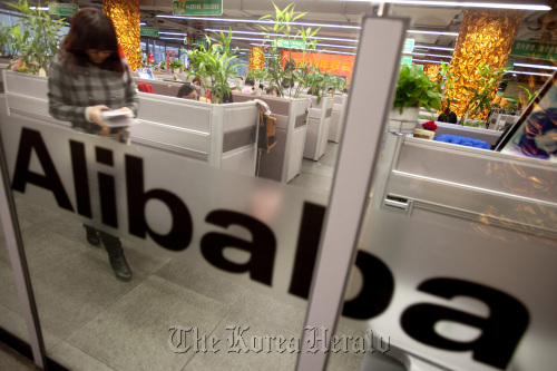 Employees work at Alibaba.com Ltd.’s headquarters in Hangzhou, Zhejiang Province, China.  Bloomberg