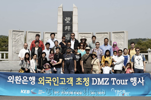 KEB expat customers pose after touring the DMZ at Imjingak in Paju, Gyeonggi Province, on Sunday.  KEB