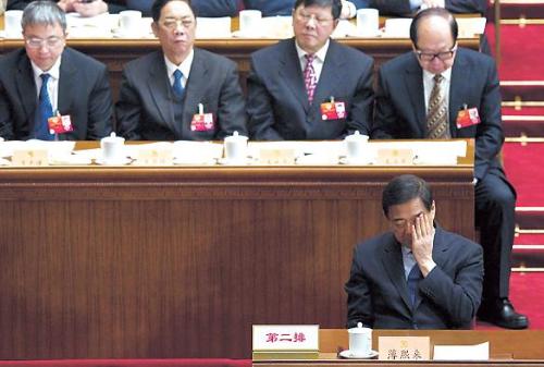 In this March 13, 2012 photo, former Chongqing Municipality Communist Party secretary Bo Xilai (front row) reacts during the closing session of the Chinese People’s Political Consultative Conference held at Beijing’s Great Hall of the People. (AP-Yonhap News)
