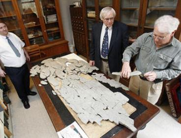 The 150-pound fossil recovered last year in northern Kentucky is more than 6 feet long and 3 feet wide. To the untrained eye, it looks like a bunch of rocks or a concrete blob. Experts are trying to determine whether it was an animal, mineral or a form of plant life from a time when the Cincinnati region was underwater.
(AP photo)