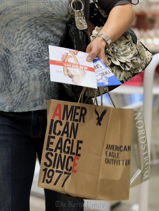 A shopper carries an American Eagle Outfitters Inc. bag at the City Creek Center in Salt Lake City, Utah.  Bloomberg