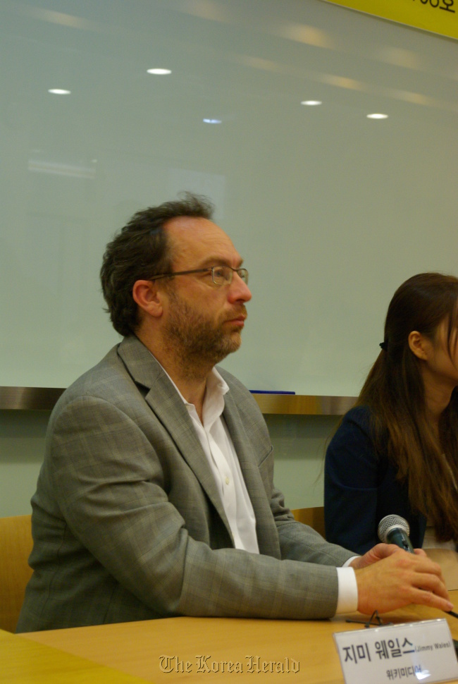 Wikipedia co-founder Jimmy Wales speaks during a news conference on Tuesday in Seoul.  Korea Venture Business Association