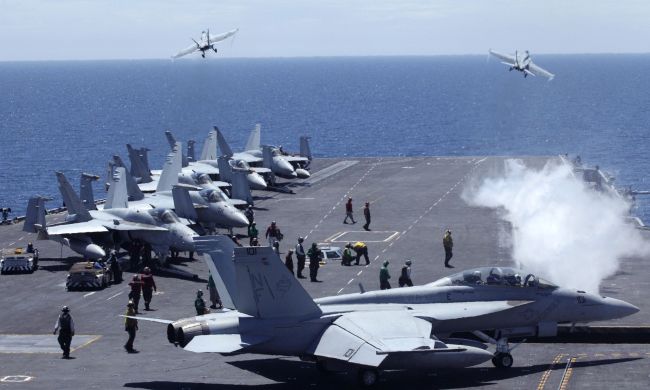 This file photo taken in 2010 shows U.S. fighters taking off from the flight deck of the Nimitz-class USS George Washington for joint military exercises between the U.S. and South Korea in the East Sea.   AFP-Yonhap News