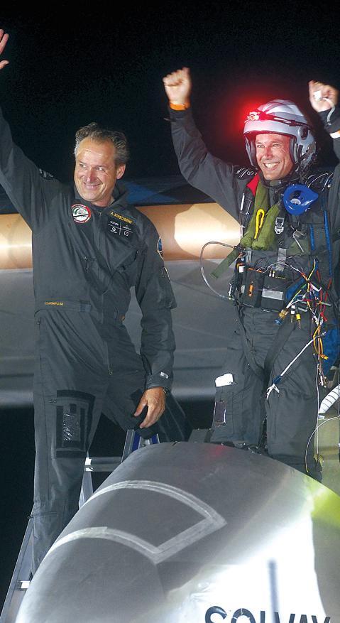 Solar Impulse pilots Bertrand Piccard (right) and Andre Borschberg wave upon arrival at Rabat airport, Morocco, Tuesday. (AP-Yonhap News)