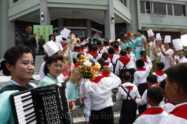 North Korean students selected as delegates to the Korean Children's Union are welcomed as they arrive for lunch at a restaurant in Pyongyang, North Korea, Sunday. (AP-Yonhap News)