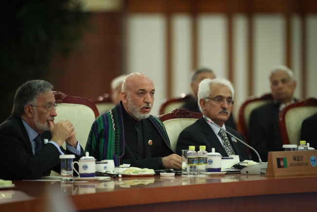 Afghan President Hamid Karzai (second from left) addresses the large group meeting of the 12th Meeting of the Council of Heads of Member States of the Shanghai Cooperation Organization at the Great Hall of the People in Beijing on June 7.  (Xinhua-Yonhap News)