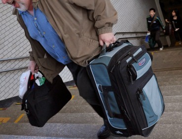 (MCT)
A U.S. woman has been arrested for trespassing after workers at her boyfriend's apartment building found she had been sneaking in by hiding in a large suitcase he carried around.