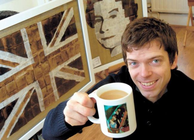 Andy Brown poses with his teabag portrait of Britain’s Queen Elizabeth II and picture of the Union Jack.
(Andy Brown)