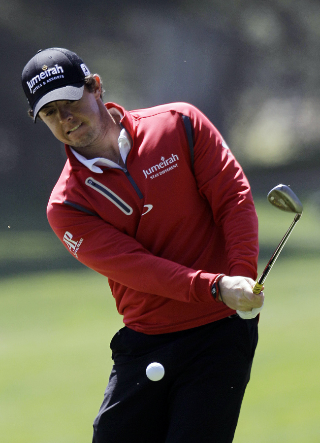 Rory McIlroy chips onto the 12th green during a practice round ahead of the U.S. Open on Tuesday.   AP-Yonhap News