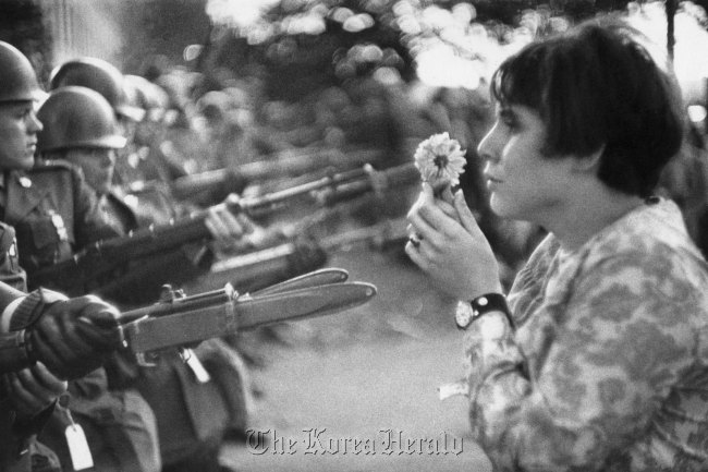 “Girl with a Flower, Vietnam War protest, Washington D.C., USA, October 21, 1967.” Marc Riboud/Covana