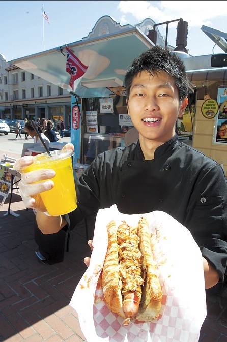 Michael Koh, a 19-year-old University of California student, serves up his signature Dojo Dogs in Berkeley, California, on April.  (MCT)