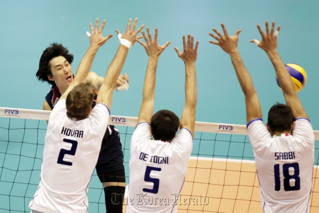 Park Chul-woo of Korea spikes against Italy on Sunday.   FIVB