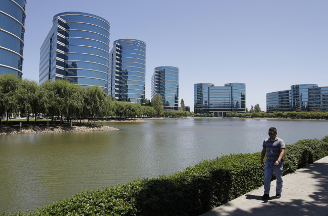 A man walks near the Oracle headquarters in Redwood City, California, Monday.      (AP-Yonhap News)