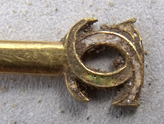 This recent undated photo provided Tuesday by the Seine et Marne region council shows part of a pin recently discovered at Fontainebleau castle, south of Paris.   AP-Yonhap News
