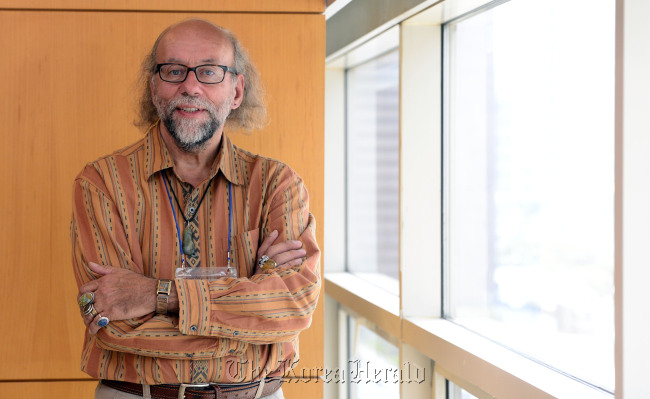 Dennis Maloney, founding editor and publisher of White Pine Press, poses for a photo prior to an interview with The Korea Herald in Seoul on Thursday. (Park Hae-mook/The Korea Herald)