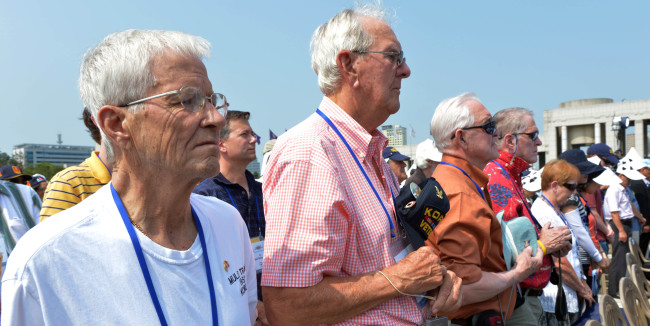 Korean War veterans and their families observe a moment of silence at the War Memorial of Korea in Seoul during the Korean War commemoration ceremony on Monday. Monday was the 62nd anniversary of the outbreak of the 1950-53 Korean War.  (Kim Myung-sub/The Korea Herald)