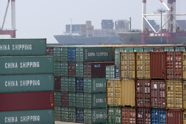 Containers are stacked at the Yangshan Deep Water Port in Shanghai.  Bloomberg