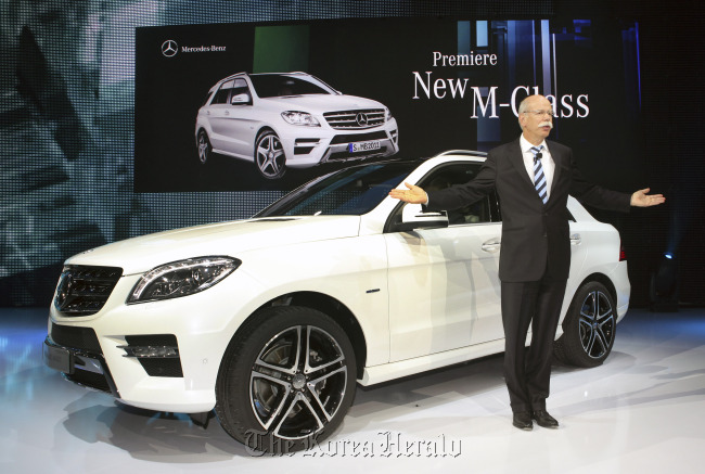 Dieter Zetsche, chief executive officer of Daimler AG, speaks during the presentation of a Mercedes-Benz M-Class hybrid sport utility vehicle at the Carl-Benz Arena in Stuttgart, Germany, last year.  Bloomberg