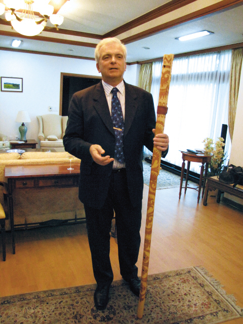Slovakian Ambassador Dusan Bella displays his country’s traditional instrument, the fujara, at his embassy last week. (Kirsty Taylor/The Korea Herald)