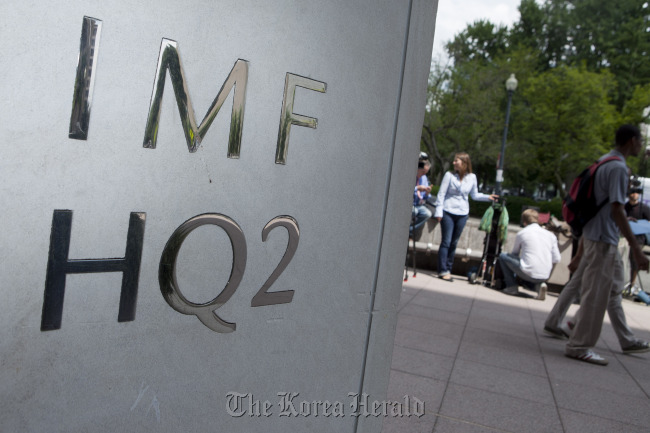 The headquarters of the International Monetary Fund stands in Washington, D.C.  Bloomberg