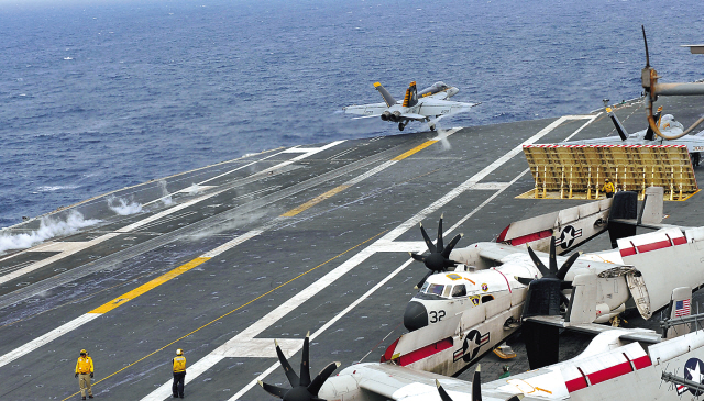An F/A-18E/F Super Hornet combat aircraft engages in take-off
and landing drills on the USS George Washington aircraft carrier
during a South Korea-U.S. joint exercise in the West Sea on June
24. (Yonhap News)