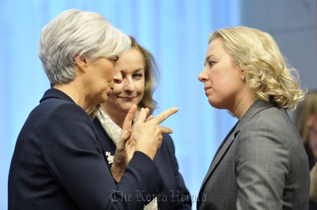 Christine Lagarde (left), managing director of the International Monetary Fund speaks with Jutta Urpilainen (right), Finland’s finance minister, during the Eurogroup finance ministers meeting at the European Council headquarters in Brussels, Belgium.  Bloomberg