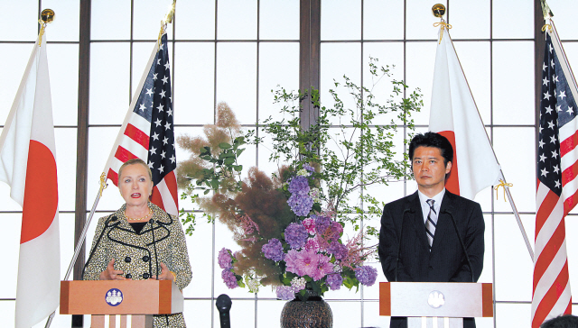 U.S. Secretary of State Hillary Rodham Clinton (left) speaks as Japanese Foreign Minister Koichiro Gemba listens during a joint press conference in Tokyo on Sunday. (AP-Yonhap News)