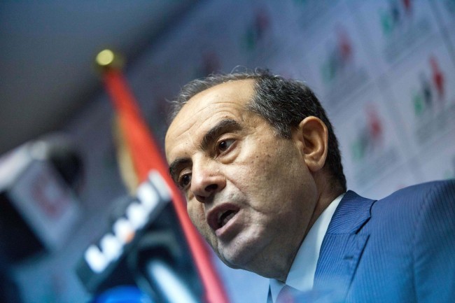 Mahmoud Jibril speaks to the media during a presser at the National Forces Allies headquarters in Tripoli on Sunday.  (AP-Yonhap News)